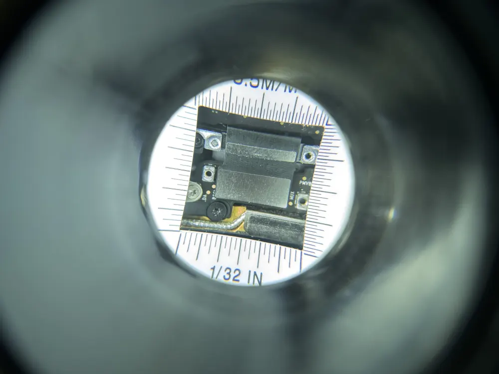 Extreme close-up of a circuit board component under magnification during micro-soldering repair